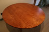Custom 48" diameter extension table - curly maple with "aged maple" finish. 