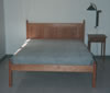 Cherry raised panel bed with low footboard
