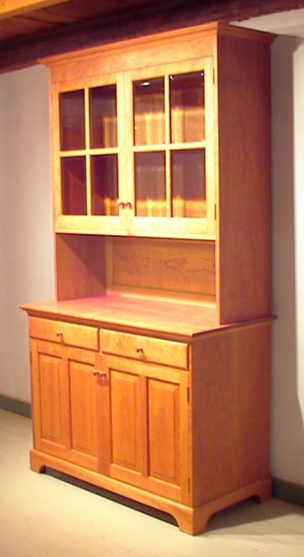 Cherry china hutch with optional glass shelf and lights in upper cabinet