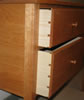 Dovetailed drawers & pinned mortise & tenon joints.