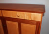 Case top is dovetailed to sides and wrapped with 1" cove molding