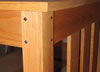 Walnut pyramid head pegs in an oak desk pin the mortise and tenon joints