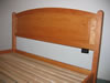 Detail of arched raised panel headboard