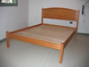 Arched raised panel headboard bed